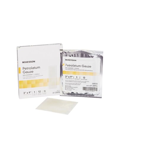 McKesson Petrolatum Gauze dressing box, individual foil packet, and unfolded gauze pad displayed together on white background