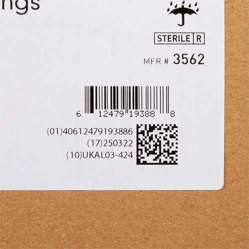 Alginate dressing box corner showing sterile label, barcode, QR code, and manufacturer number 3562 on white and cardboard