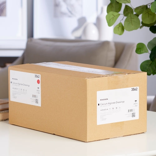 McKesson Calcium Alginate Dressings bulk cardboard shipping box labeled item 3562, sitting on a white surface indoors