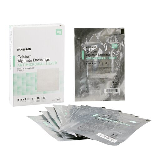 McKesson calcium alginate antimicrobial silver dressings box with sealed foil individual packets fanned out nearby