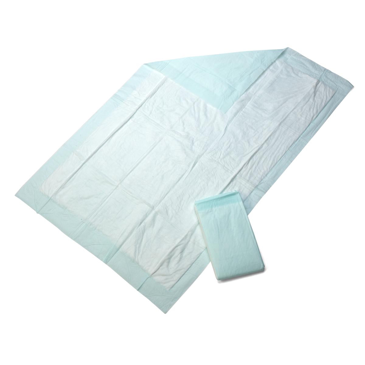 Disposable underpad laid flat showing white absorbent top and light blue backing, with a folded pad beside it