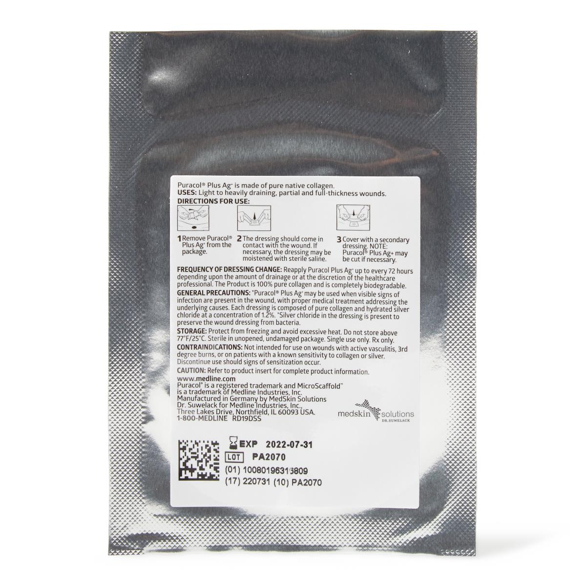 Wound dressing back of silver foil single-use packet showing directions for use, precautions, and lot number label on white