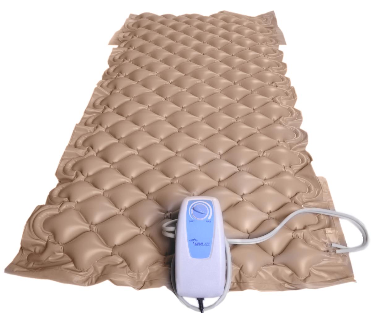 Alternating pressure pad with bubble-cell surface in tan vinyl, shown with electric pump unit and connecting tubing
