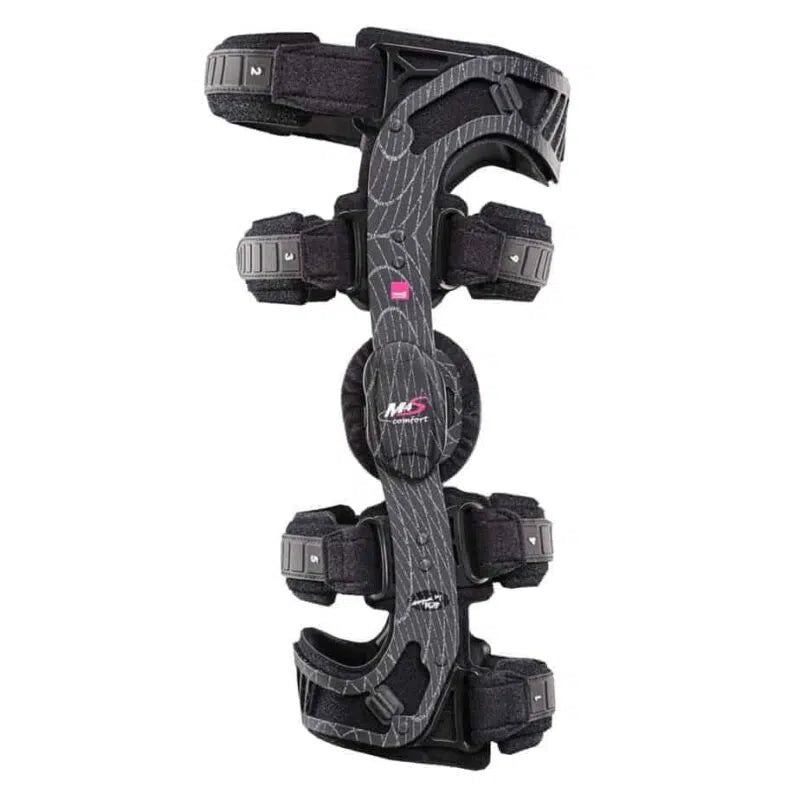 M.4s Comfort knee brace with black carbon-fiber frame, dual hinges, numbered straps, and pink logo accent