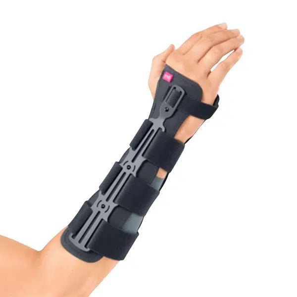 Wrist fracture brace with rigid volar splint and adjustable straps worn on a left forearm, shown against white background
