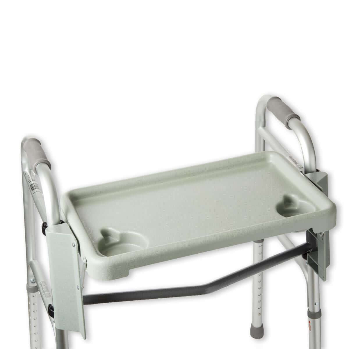 Walker tray accessory in light green with two cup holders, clipped onto a silver aluminum folding walker frame