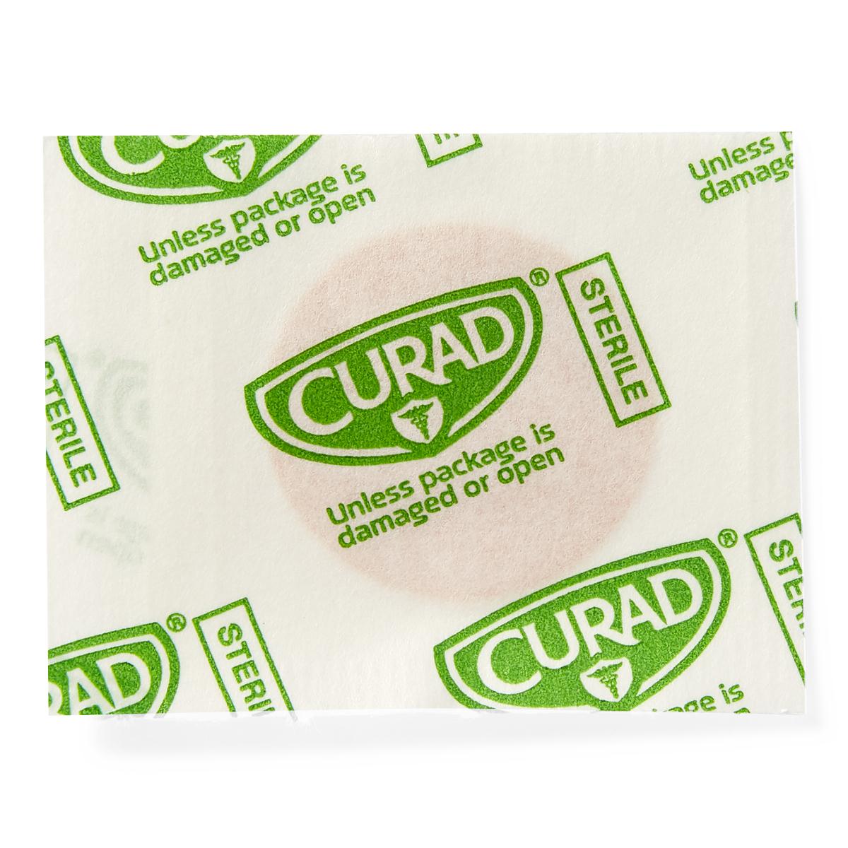 Curad sterile spot adhesive bandage in sealed white packaging with green branding and sterile indicators