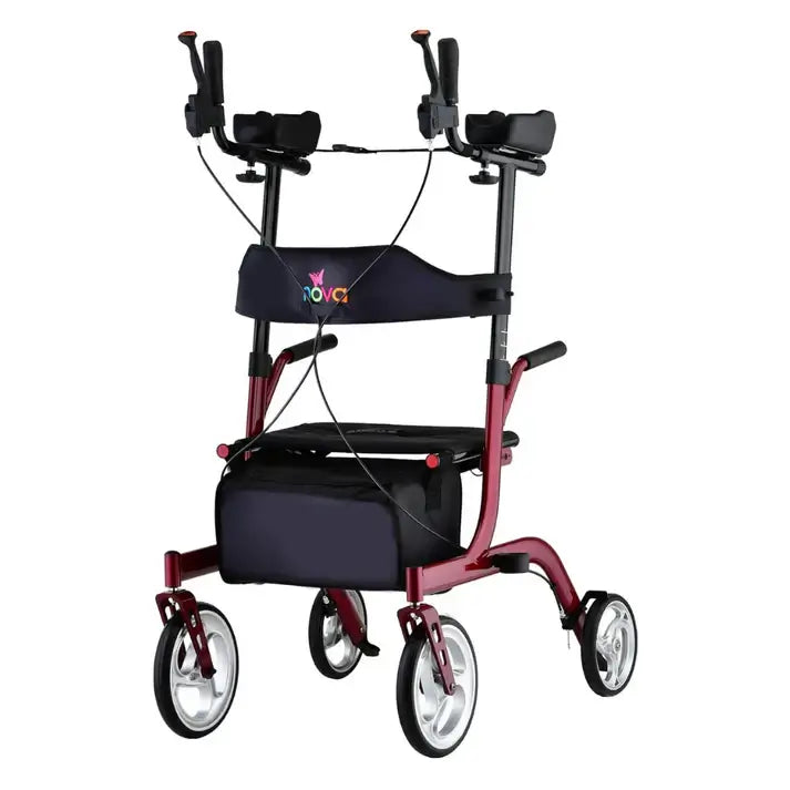 Upright rollator walker with padded forearm rests, hand brakes, fold-down seat, storage bag, and four wheels in red frame