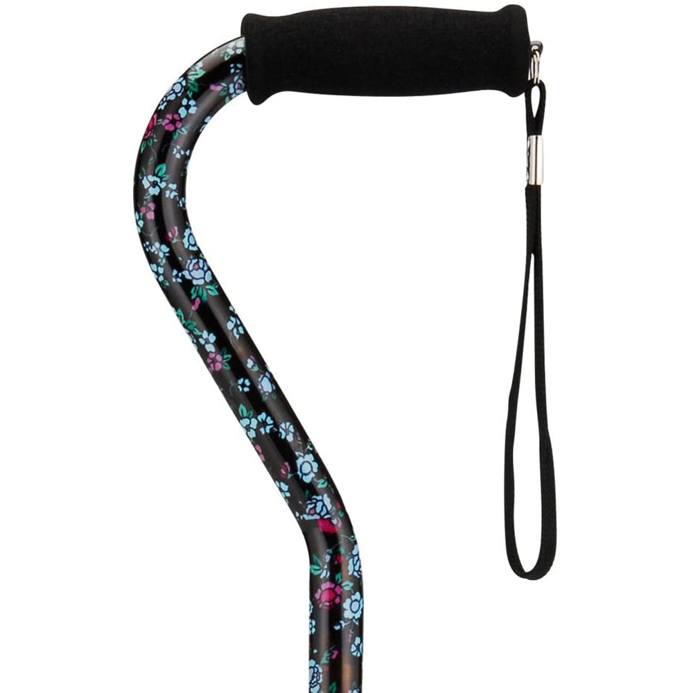 Offset cane with black floral print shaft, foam grip handle, and wrist strap
