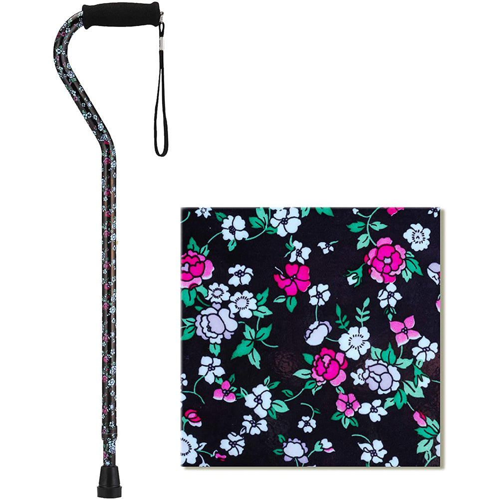 Offset walking cane with black foam handle and wrist strap, featuring a dark floral print with pink and white flowers and