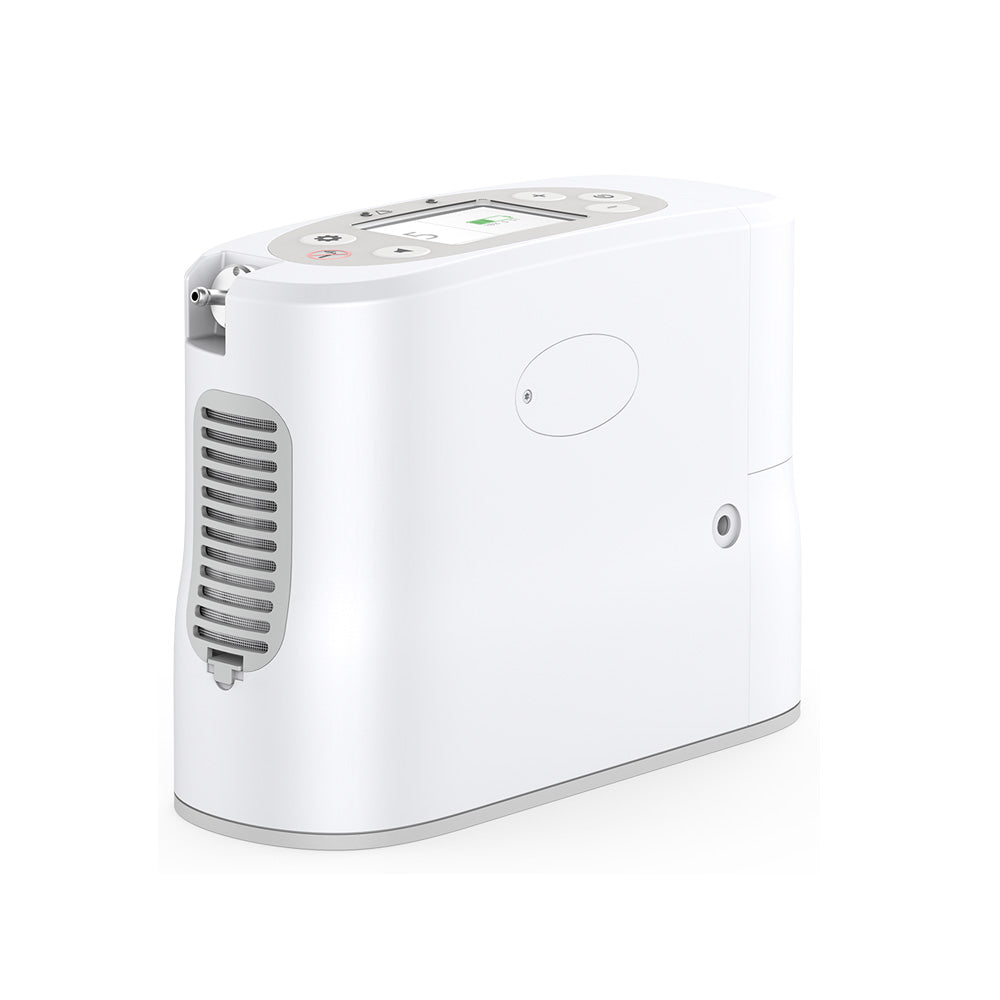 Portable oxygen concentrator in white with gray vents, top control panel with display, and oxygen outlet port, shown at an