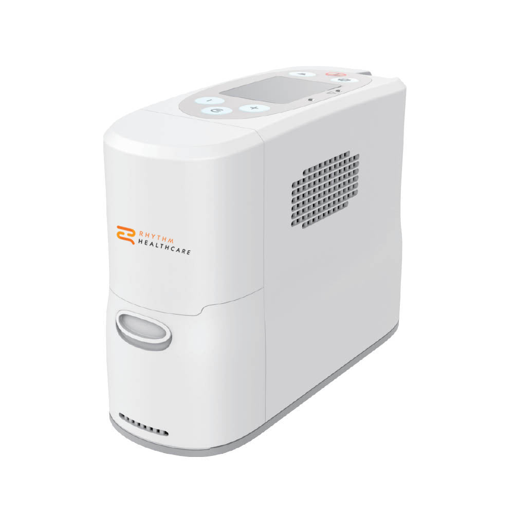 Portable oxygen concentrator in white with top control panel, display screen, side vent, and Rhythm Healthcare logo on front