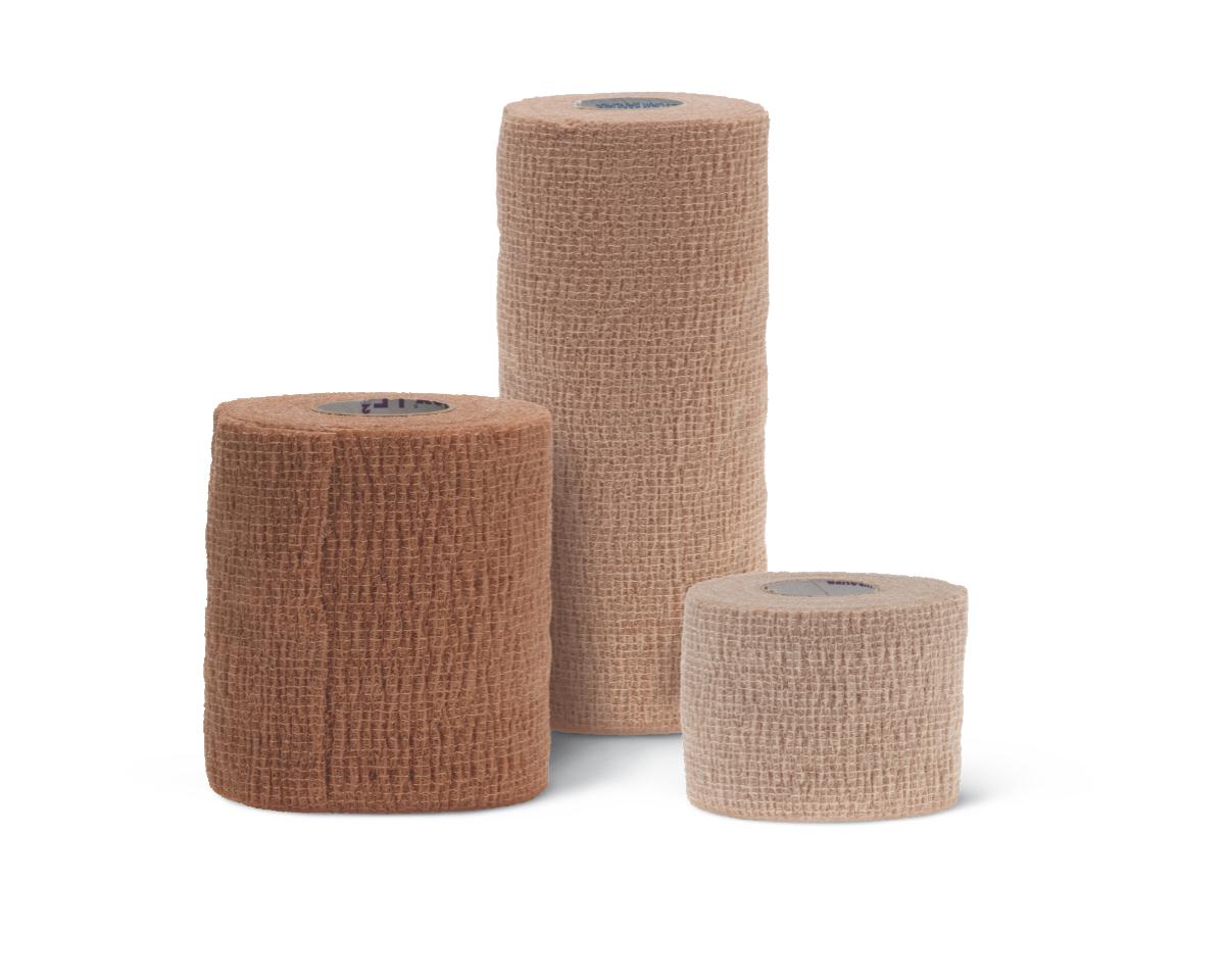 Cohesive bandage rolls in three sizes and tan shades arranged together on a white background