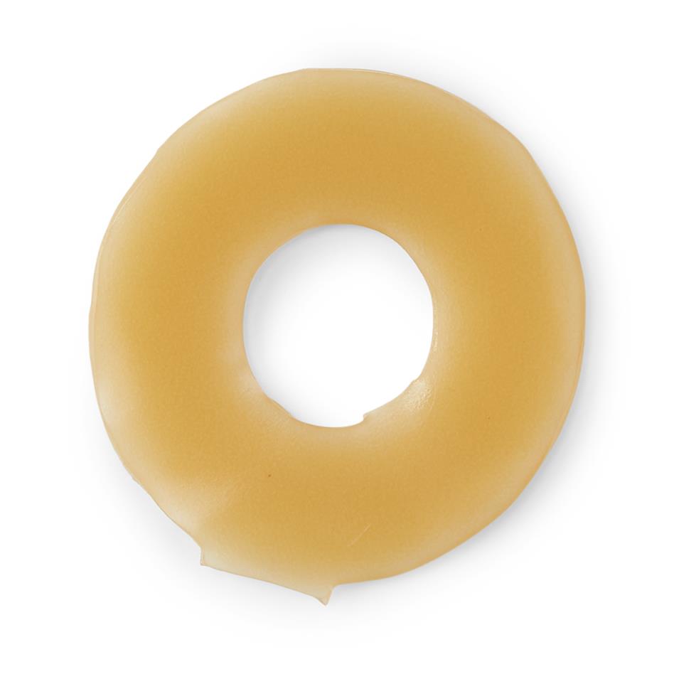 Ostomy barrier ring in tan hydrocolloid material with circular center opening, shown on white background