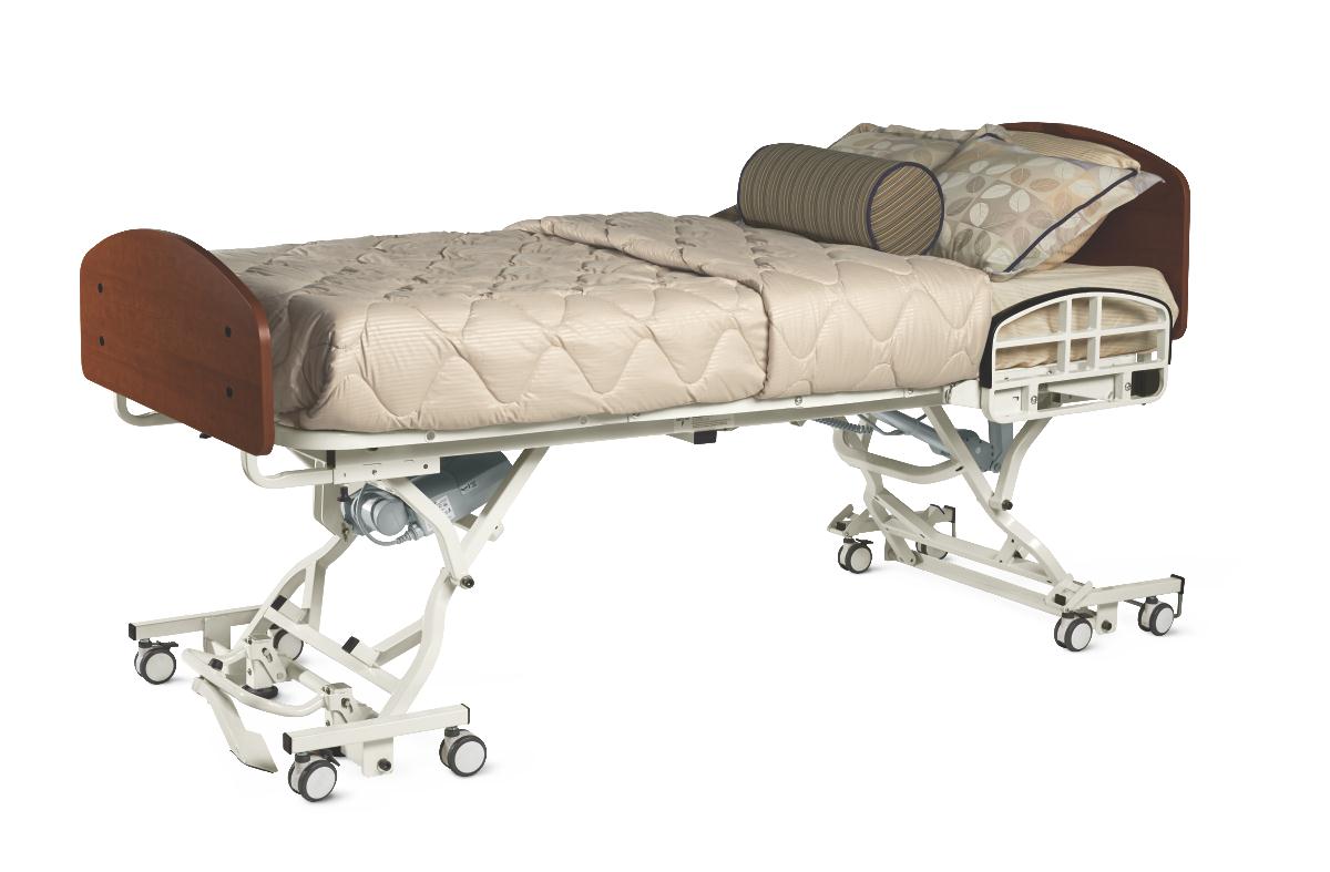 Full electric hi-lo hospital bed with wood-finish headboard, quilted mattress, half side rails, and rolling casters