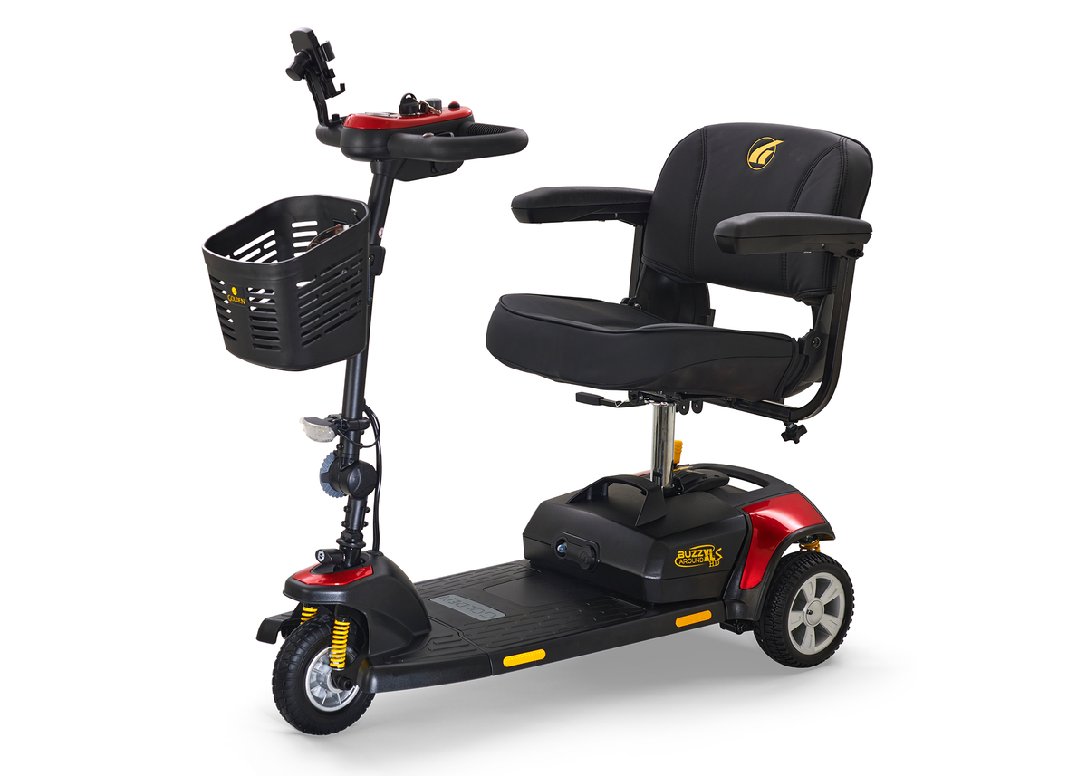 3-wheel power mobility scooter in red and black with padded seat, armrests, front basket, tiller controls, and yellow