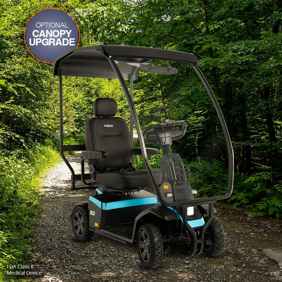 Pride PX4 heavy-duty 4-wheel mobility scooter in black and teal with optional canopy upgrade, shown outdoors on a gravel path