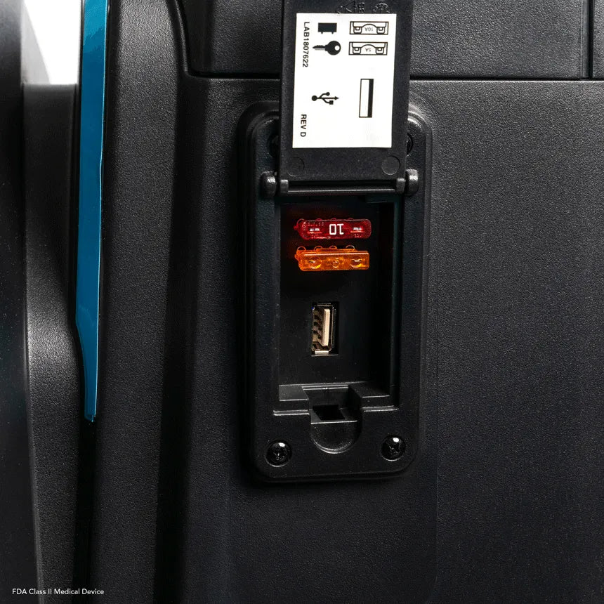 Power scooter side panel close-up showing open access door with USB port, fuse indicators, and Ethernet port with indicator