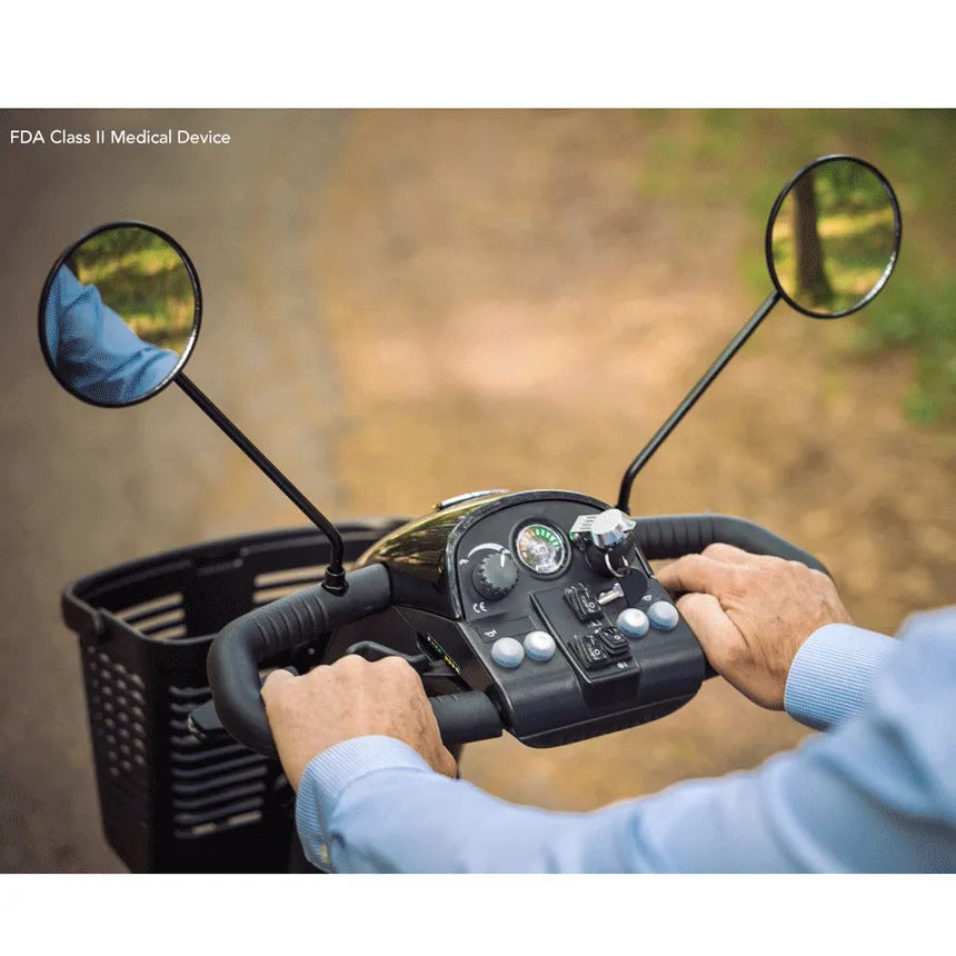 Pride Pursuit 2 mobility scooter tiller with dual rearview mirrors, control panel, and handlebar grips held by a rider