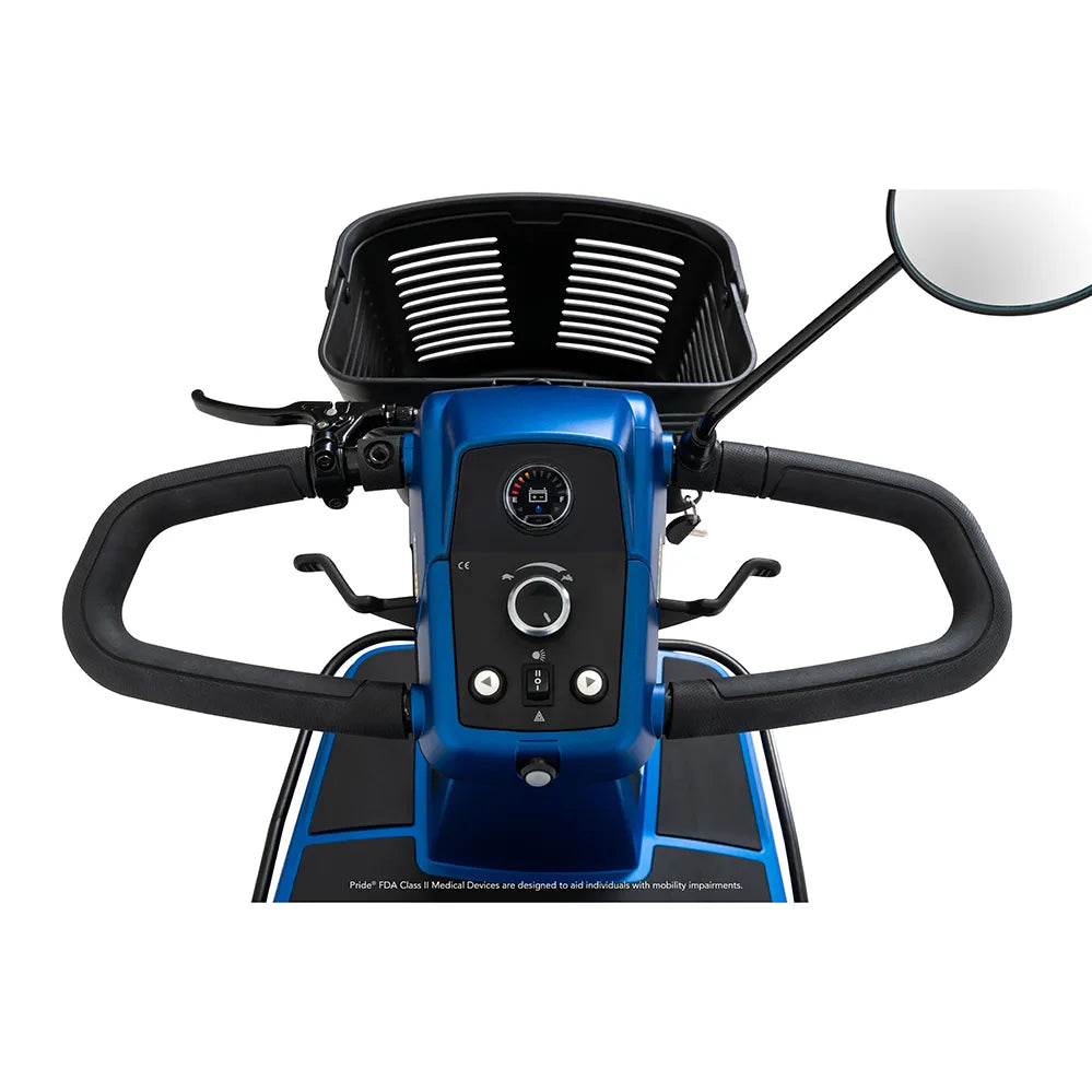Power mobility scooter tiller closeup showing blue control panel, speed dial, battery gauge, handlebar, mirror, and front