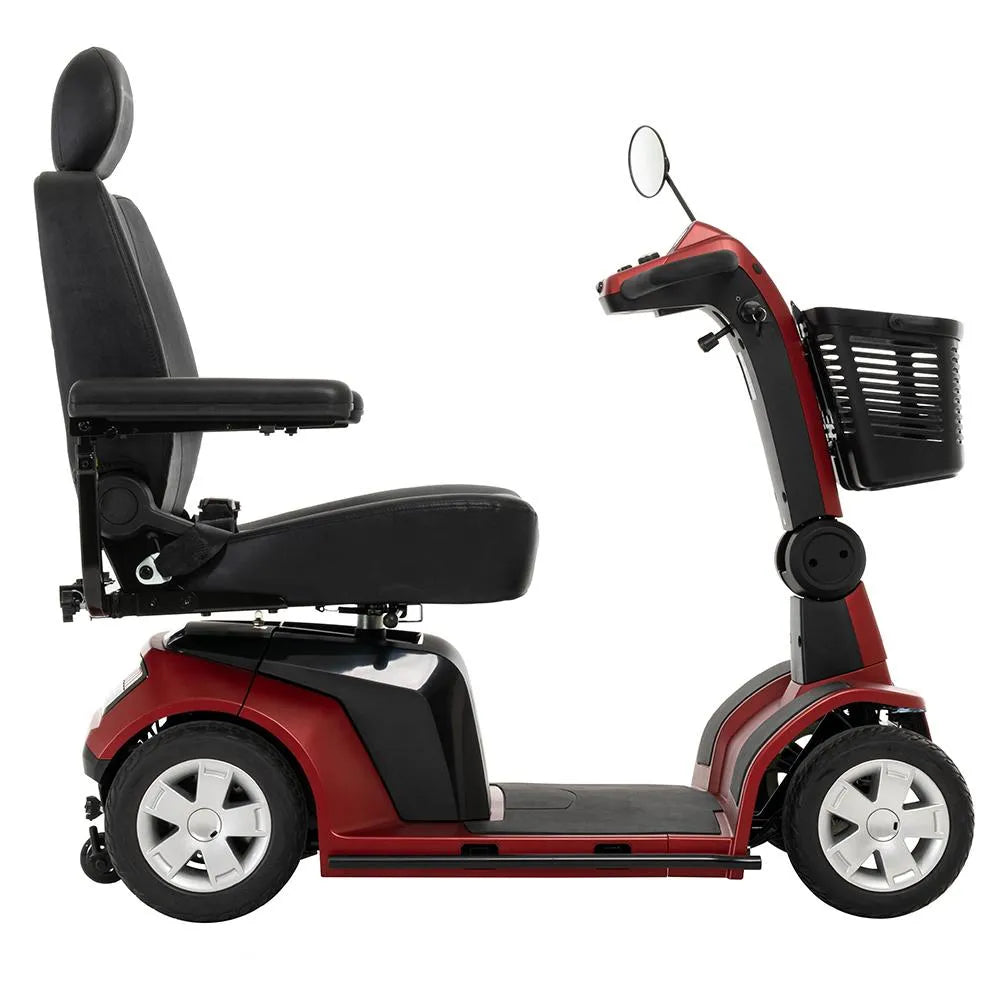 4-wheel power mobility scooter in red with black high-back captain's seat, front basket, rearview mirror, and large tires