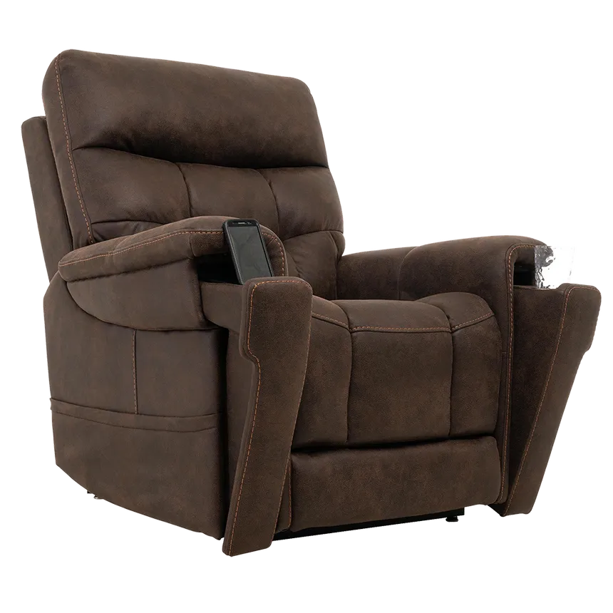 Lift chair in brown microfiber upholstery with tufted back, padded armrests, and a remote control resting on the armrest