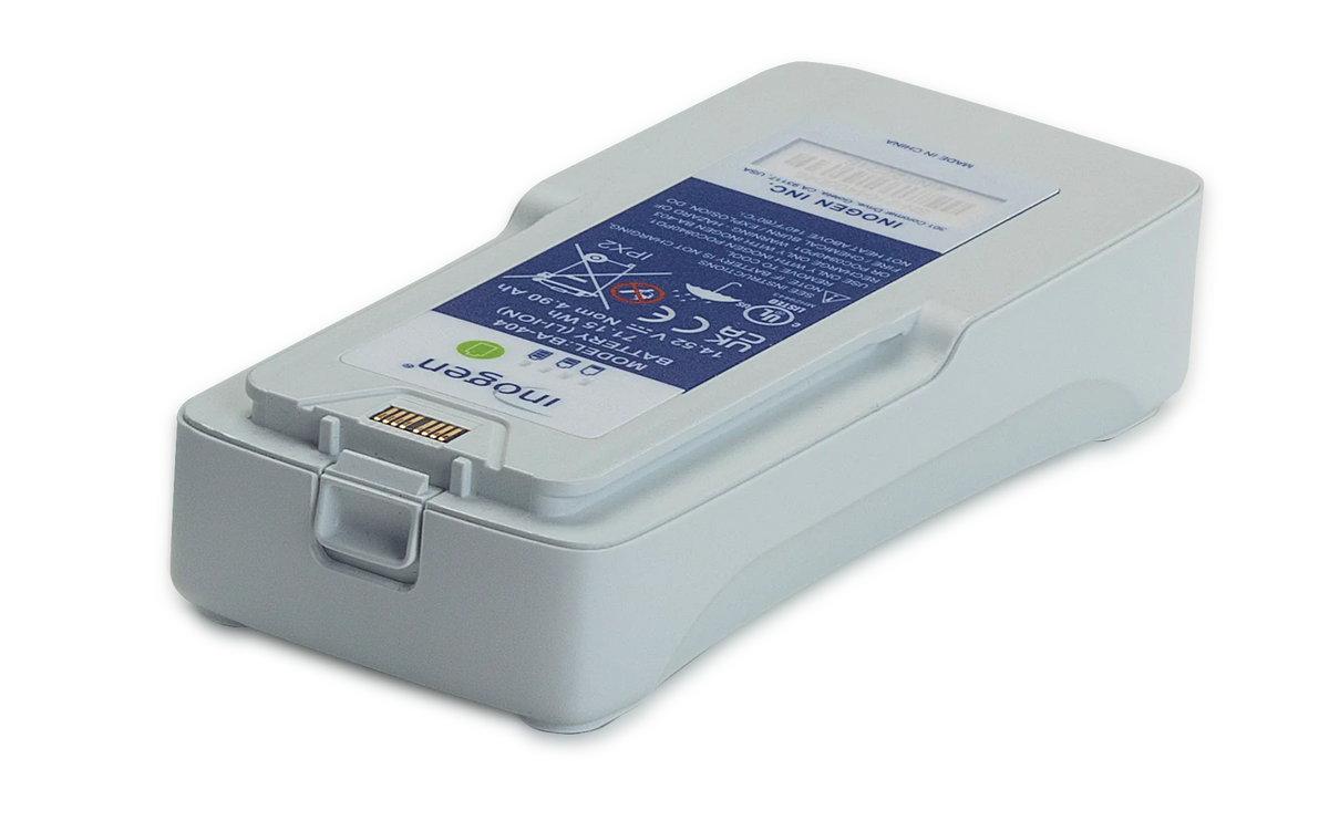 Inogen Rove 4 portable oxygen concentrator battery pack, white rectangular unit with label and connector contacts, shown on