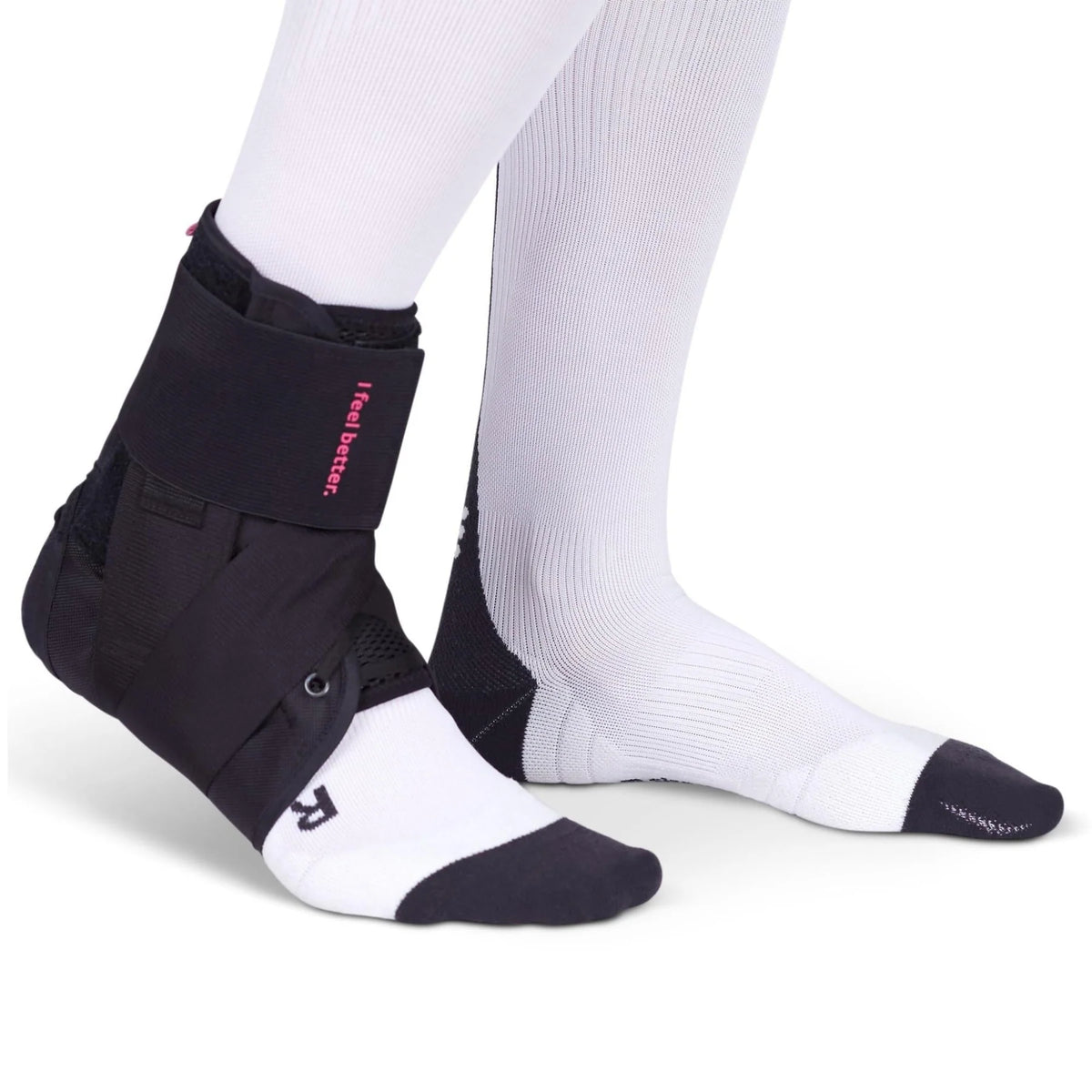 Ankle brace with lace-up closure and wraparound straps worn over a white sock, shown from the side on both legs