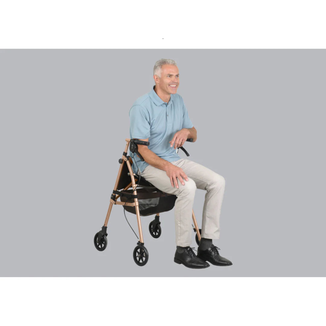 Rollator with rose gold frame and storage basket, shown with a smiling older man seated on its padded seat