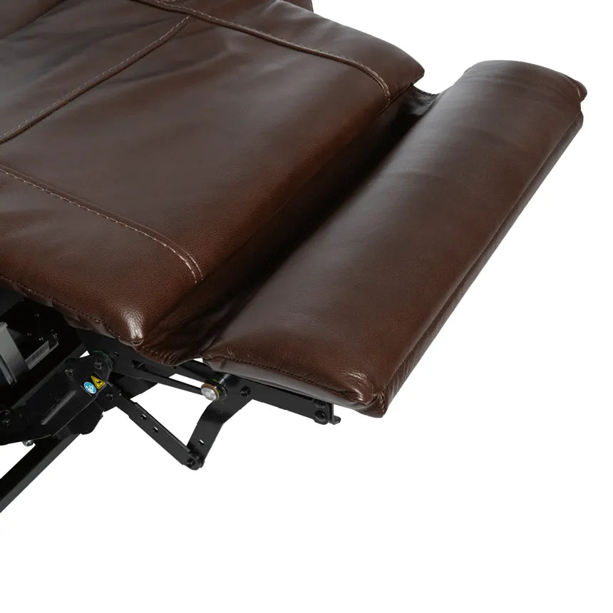 Lift chair footrest extended, showing brown faux leather upholstery and metal reclining mechanism underneath