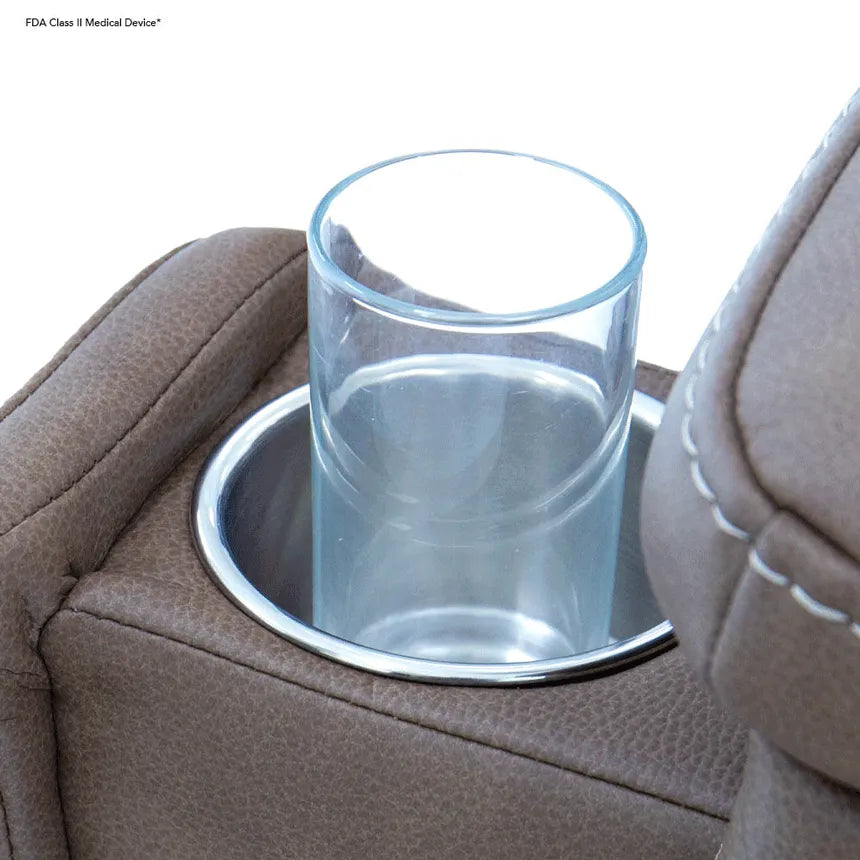 Lift recliner armrest with built-in chrome cup holder holding a clear drinking glass, upholstered in brown textured fabric