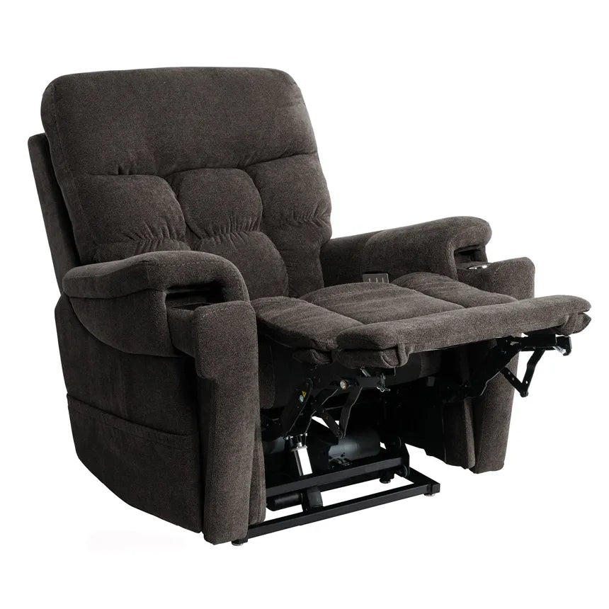 Power lift recliner in dark charcoal fabric with tufted back, padded armrests, and footrest extended showing lift mechanism