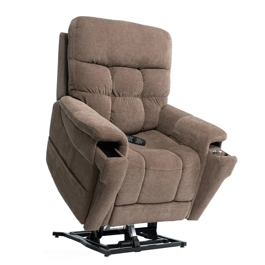Power lift recliner in brown tufted fabric with armrest cup holders, side pocket, and hand remote, shown upright