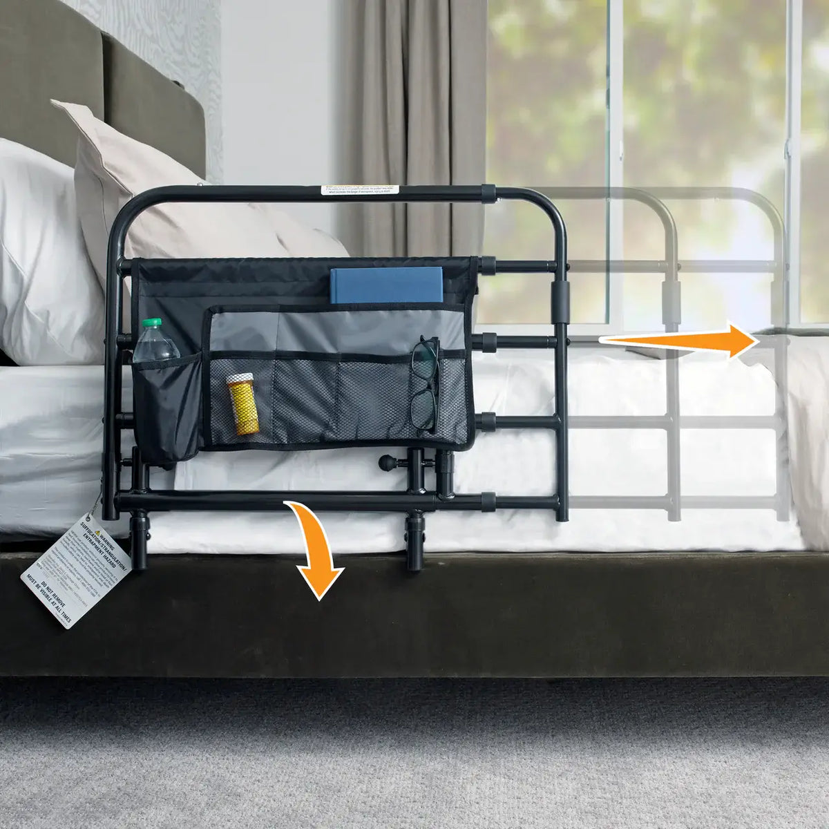 Bed rail with attached organizer pocket holding a water bottle, pill bottle, and glasses, shown installed on a bedroom bed