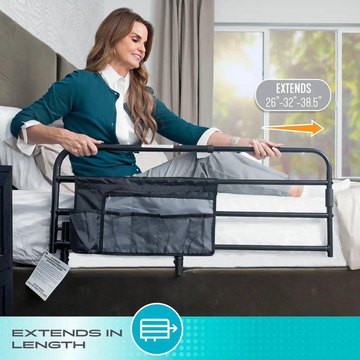 Bed rail with storage pouch attached to bed side as woman grips rail while getting up, shown in bedroom setting