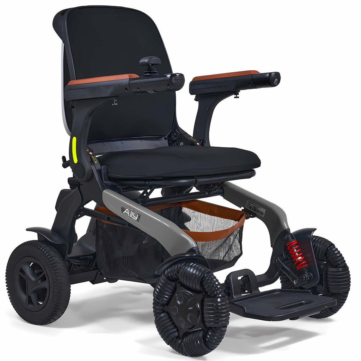 Power wheelchair with black upholstery, brown armrest accents, joystick control, under-seat storage basket, and all-terrain