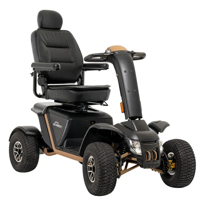 Power mobility scooter in black and tan with large all-terrain tires, padded captain's seat, armrests, and tiller steering