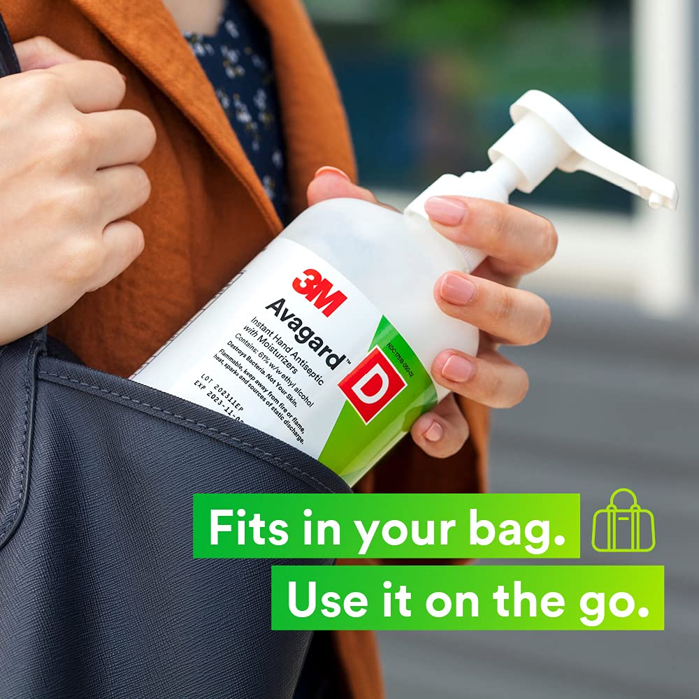Hand antiseptic pump bottle being placed into a bag outdoors, shown in lifestyle use context