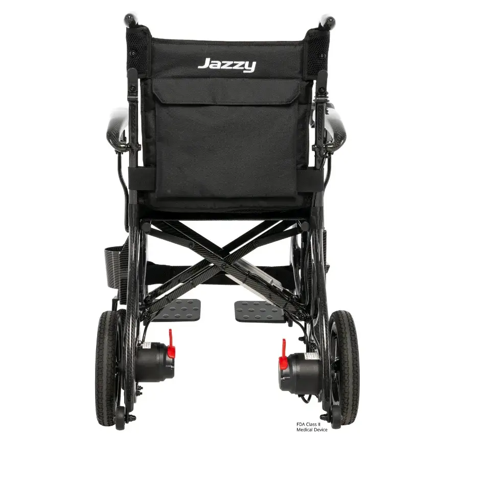 Jazzy Carbon power wheelchair rear view showing black seat back with storage pocket, carbon fiber frame, dual motors, and