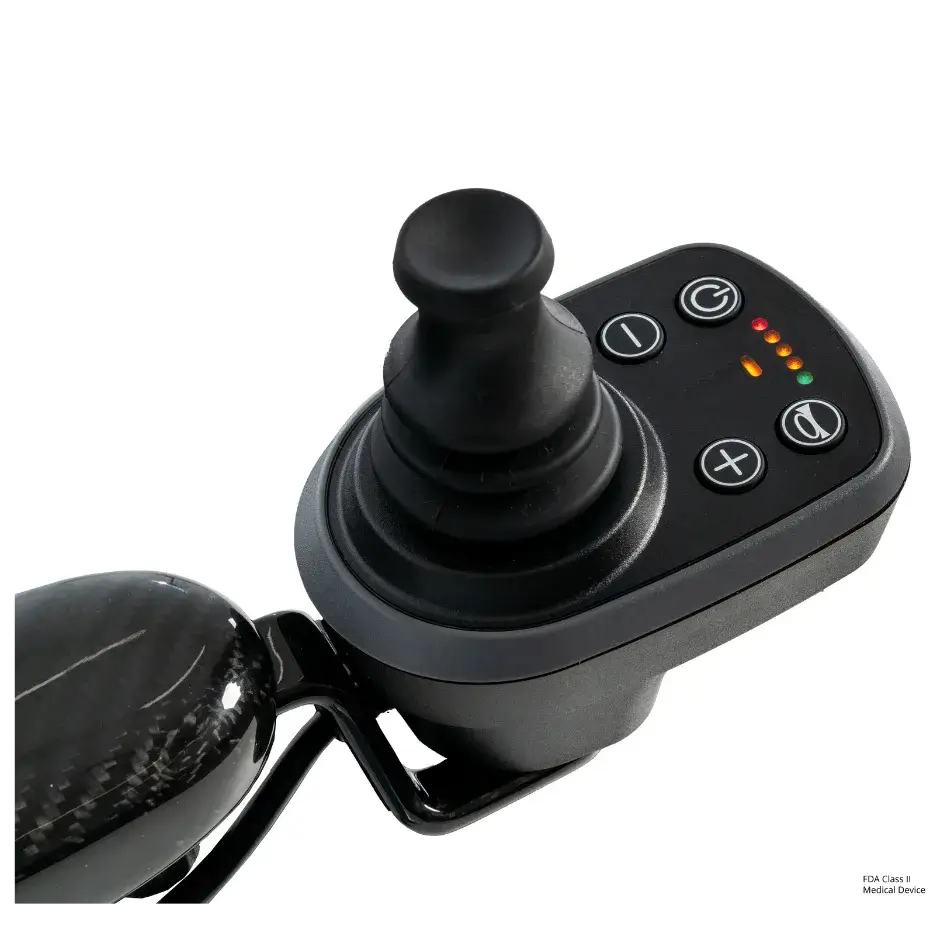 Power wheelchair joystick controller with black rubber knob, four buttons, and red, orange, and green indicator lights