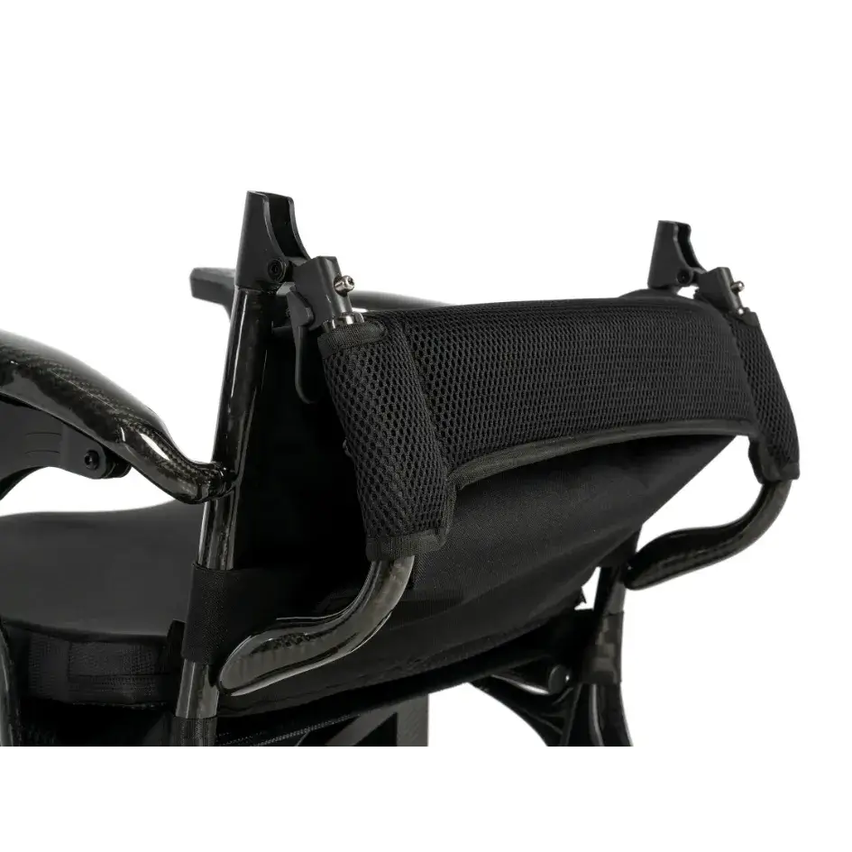 Jazzy Carbon power wheelchair black mesh headrest support with adjustable mounting hardware, close-up view