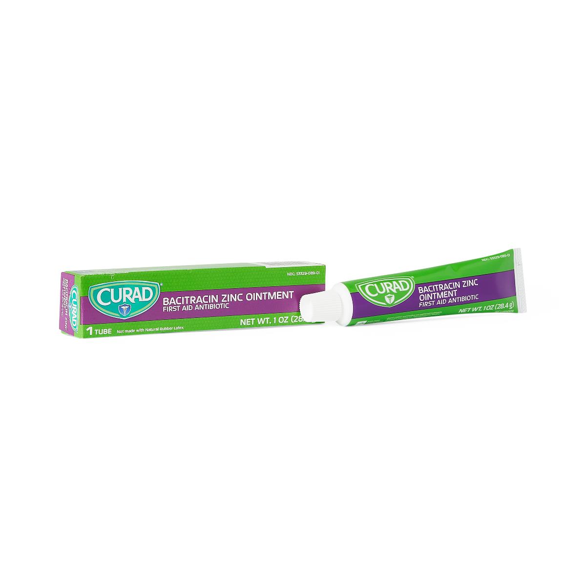 Curad Bacitracin Zinc Ointment tube and green box with purple label, 1 oz, on white background