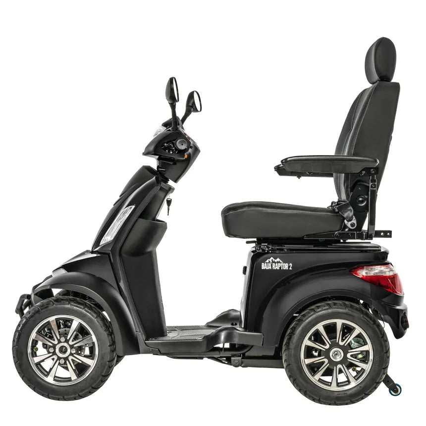 Four-wheel mobility scooter in black with high-back captain's seat, armrests, rearview mirror, and large all-terrain tires