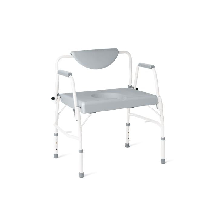 Bariatric drop arm steel commode with wide gray padded seat, removable cutout, padded armrests, and adjustable white steel