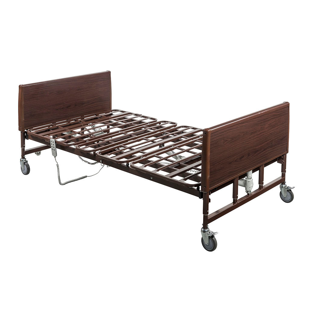 Bariatric homecare bed with dark wood-grain head and footboards, metal frame, locking casters, and electric hand control