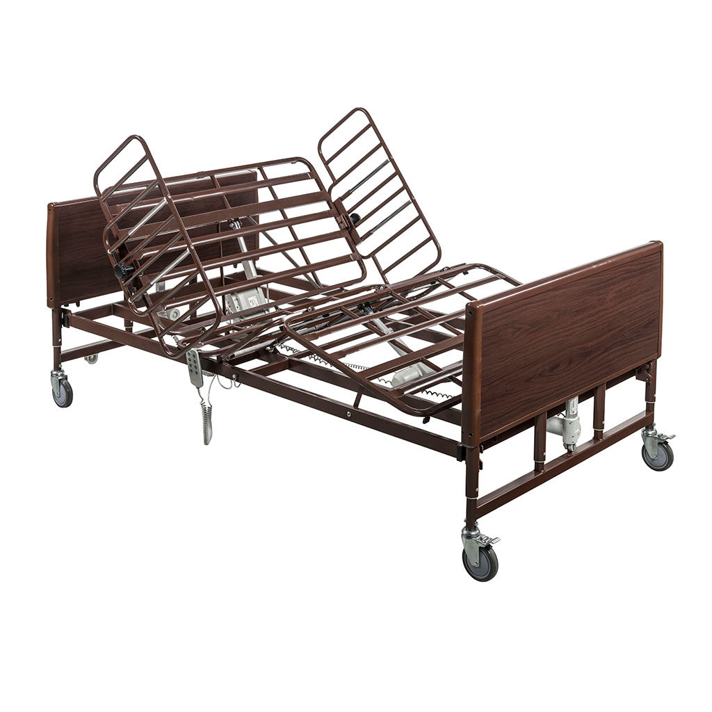 Bariatric homecare bed with dark walnut wood panels, raised head section, full-length side rails, casters, and hand control