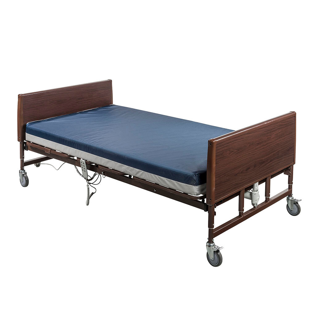 Lightweight bariatric homecare bed with walnut wood panels, blue mattress, brown metal frame, hand control, and rolling