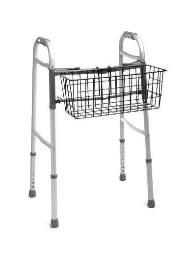 Walker basket with black wire construction mounted to a silver folding walker with gray rubber tips and hand grips
