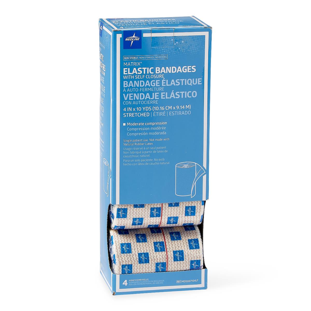 Elastic bandages in open blue box showing four rolled beige compression wraps with blue logo pattern and red center stripe