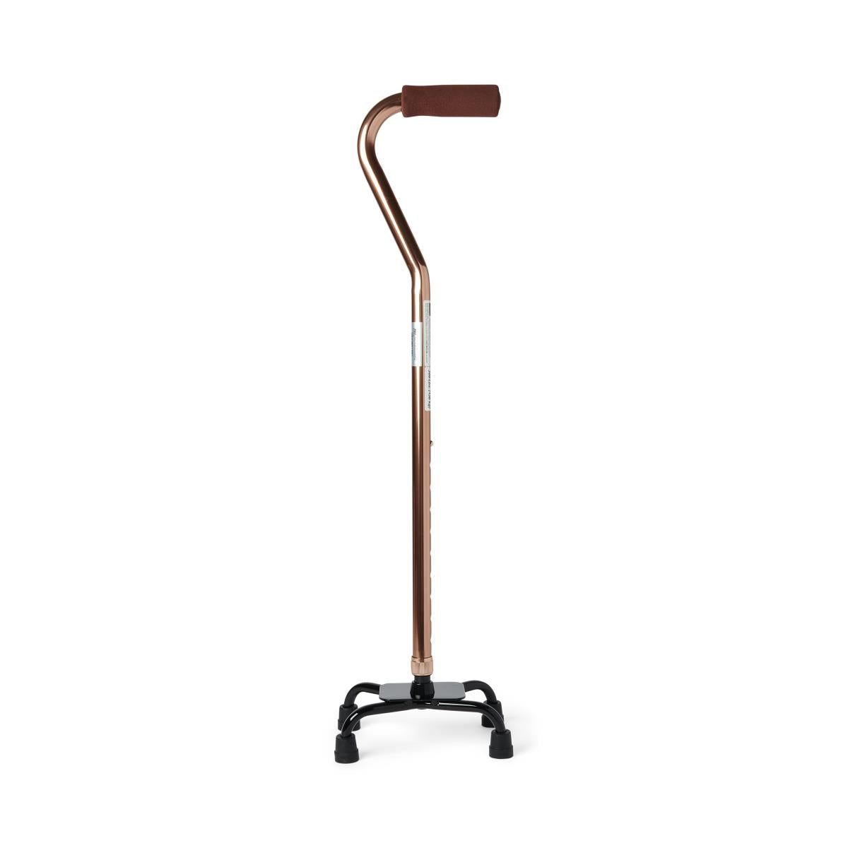 Quad cane with bronze shaft, brown foam handle, and small four-legged black base with rubber tips